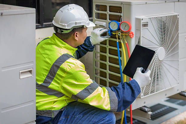 Professional Heat Pump Repair technician working in Hills, IA